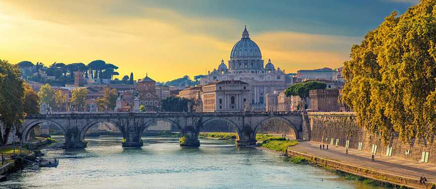 Boat sailing on Tiber River with Saint Peter's Basilica in Rome, Italy Boat sailing on Tiber River with Saint Peter's Basilica in Rome, Italy