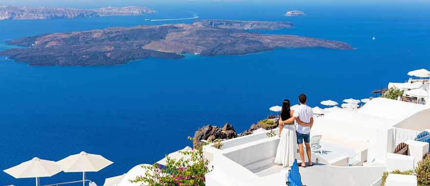 Santorini, Greece Couple enjoying the view in Santorini, Greece