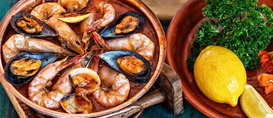 Authentic Culinary Tour of Portugal - Seafood Cataplana Seafood Cataplana, traditional Portuguese stew served in the Algarve region of Portugal