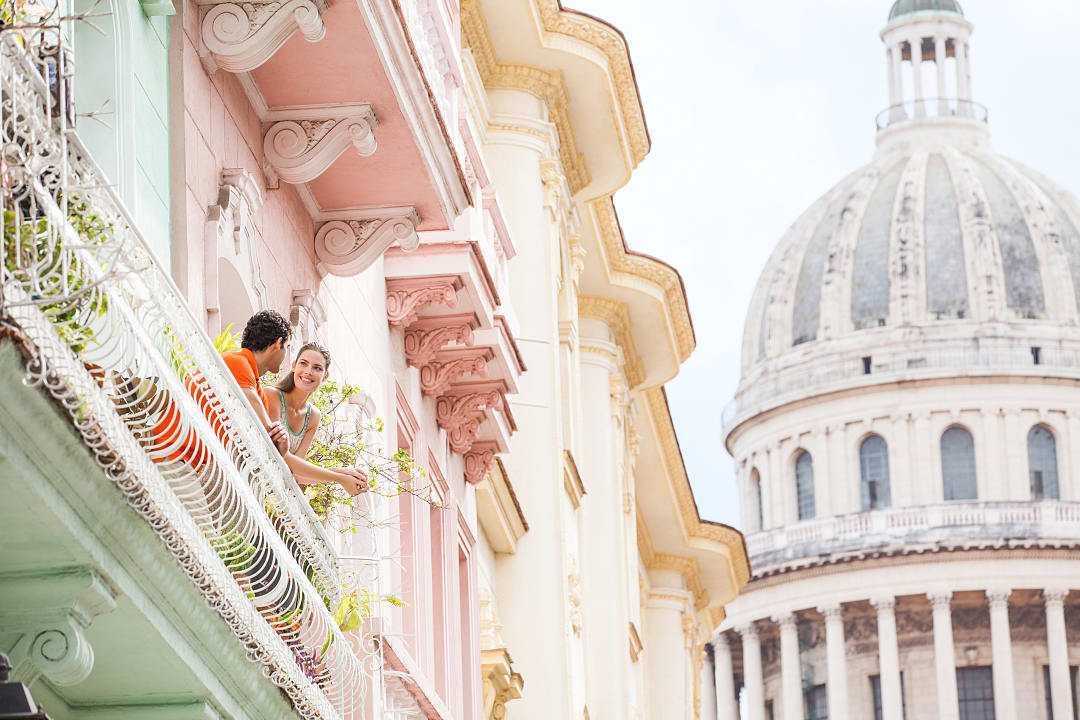 Couple on a balcony in Havana, Cuba