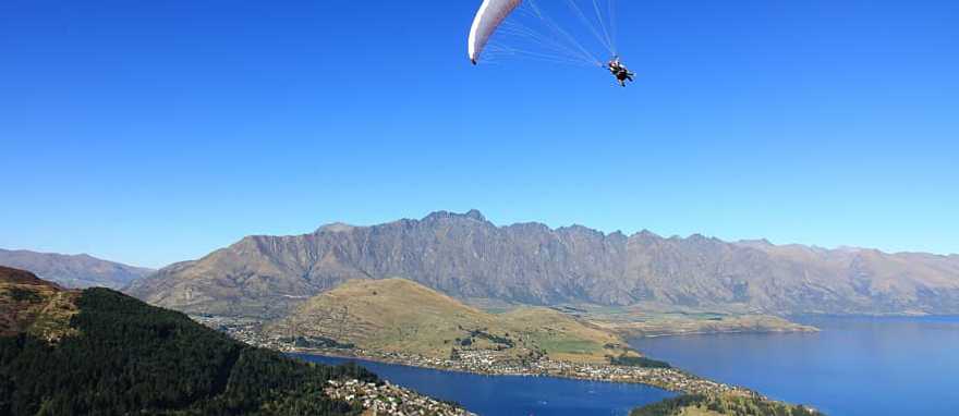 Hang glider over Queenstown South Island, New Zealand Hang glider over Queenstown South Island, New Zealand
