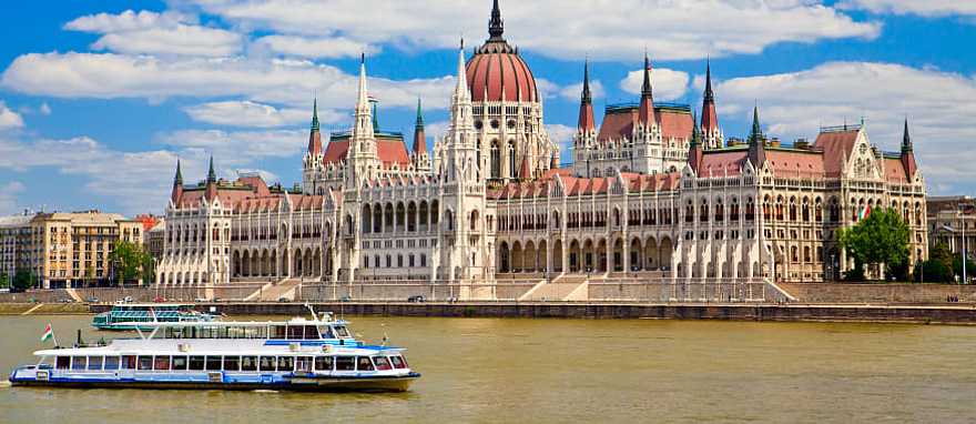 View of the Parliament with boat in Budapest, Hungary View of the Parliament with boat in Budapest, Hungary