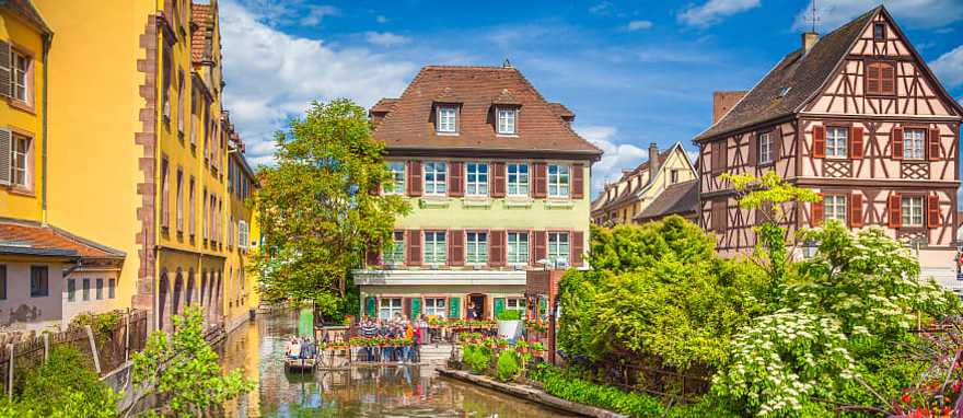 Colorful traditional houses on idyllic river in Colmar, Alsace Region, France Colorful traditional houses on idyllic river in Colmar, Alsace Region, France