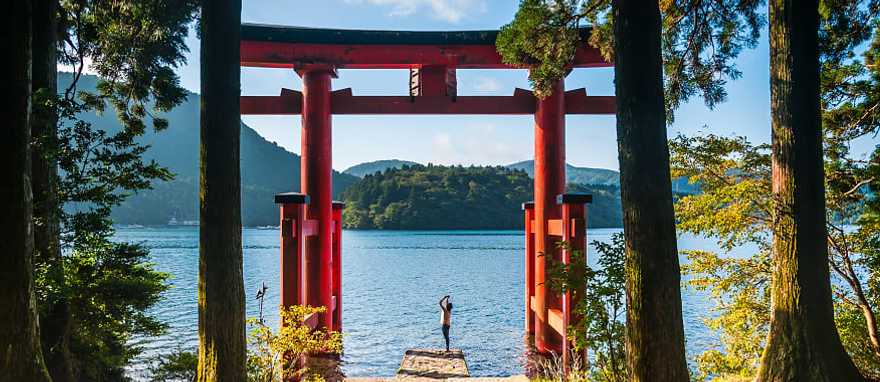 A Torii gate by lake in Hakone, Japan. A Torii gate by lake in Hakone, Japan.