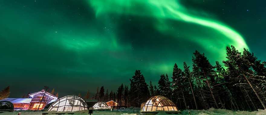 Aurora Borealis above igloos in Finland Aurora Borealis above igloos in Finland