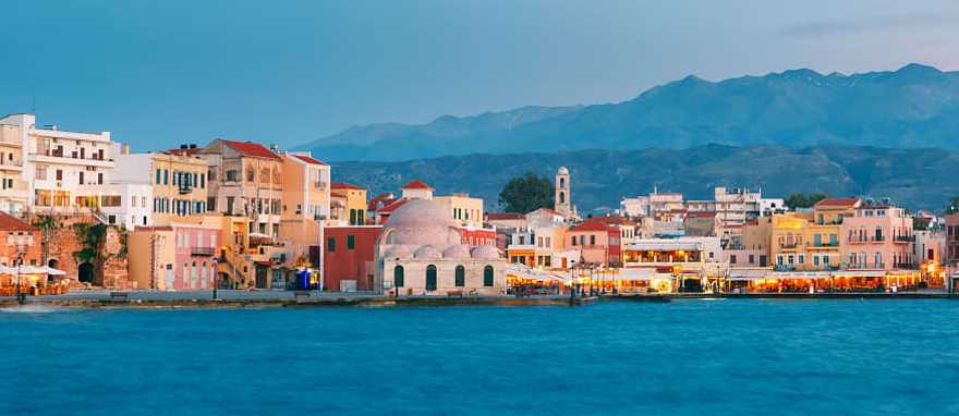 Chania in Crete, Greece Venetian Quay of Chania with Kucuk Hasan Pasha Mosque during twilight blue hour, Crete, Greece