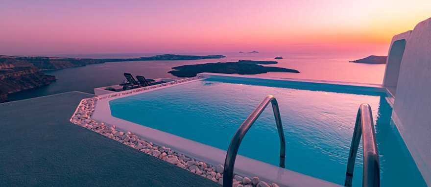 Athens & Santorini Honeymoon Package - Infinity pool overlooking the Aegean Sea at sunset in Santorini, Greece Athens & Santorini Honeymoon Package - Infinity pool overlooking the Aegean Sea at sunset in Santorini, Greece
