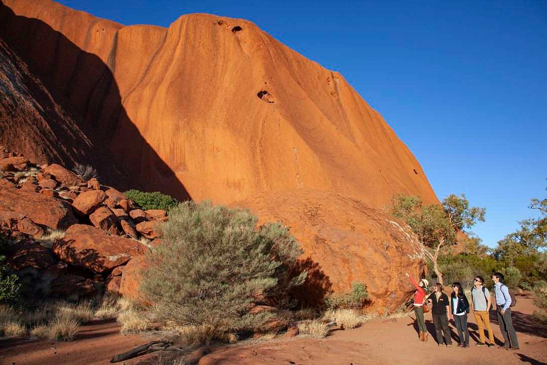 Family on private tour at Uluru in the Northern Territory, Australia