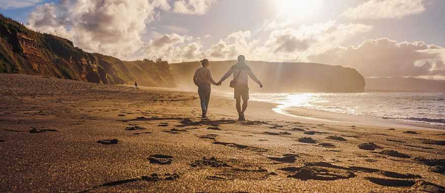Sao Miguel Island in the Azores, Portugal Couple walking on the beach in Sao Miguel, Azores, Portgal