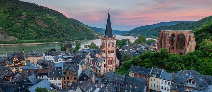 Parish Church of St. Peter surrounded by local homes and vineyards Bacharach, Germany during sunset. Parish Church of St. Peter surrounded by local homes and vineyards Bacharach, Germany during sunset.