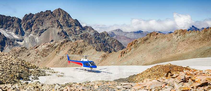 Helicopter on the southern alps mountain range in New Zealand Helicopter on the southern alps mountain range in New Zealand