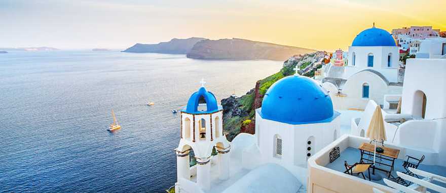 Best of Santorini - Ideal Greece Vacation - Classical view of Oia village with white and blue architecture Best of Santorini - Ideal Greece Vacation - Classical view of Oia village with white and blue architecture