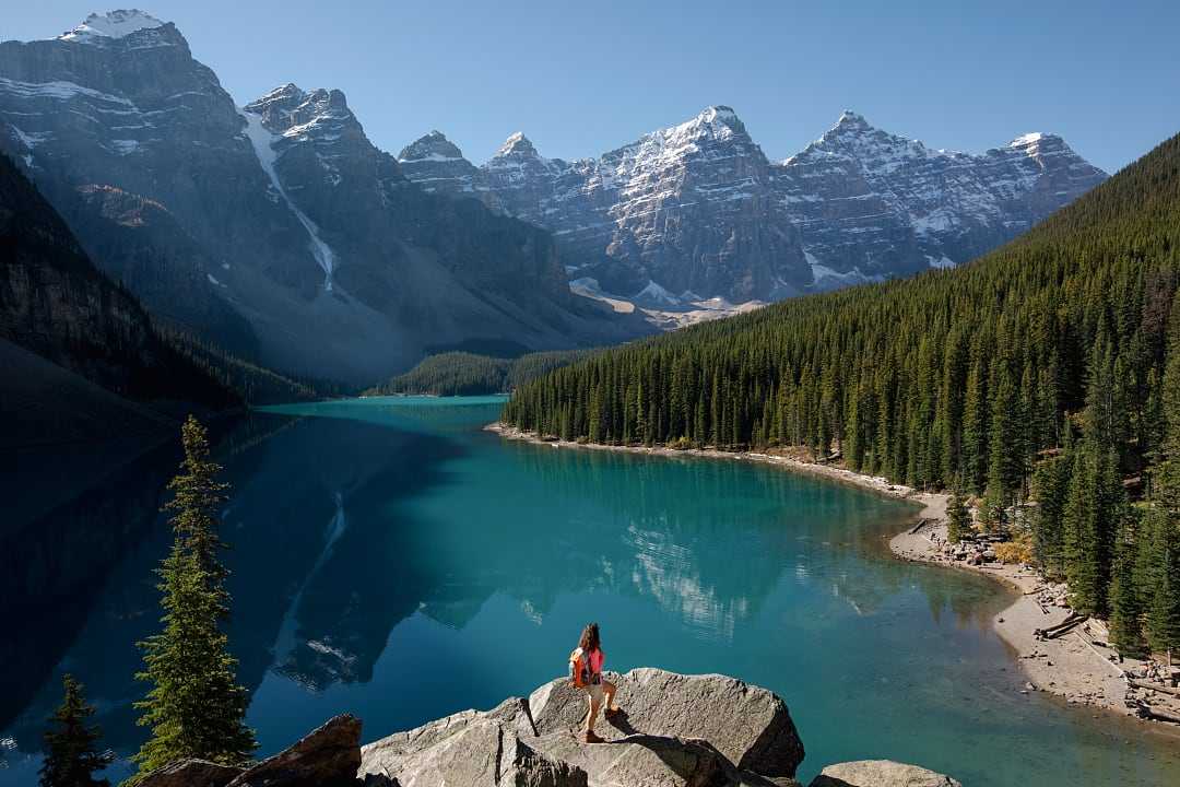 Woman hiking at Moraine Lake in Banff National Park, Canada